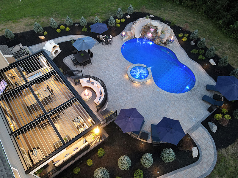 an aerial view of a large backyard with a large swimming pool and Wolf decking