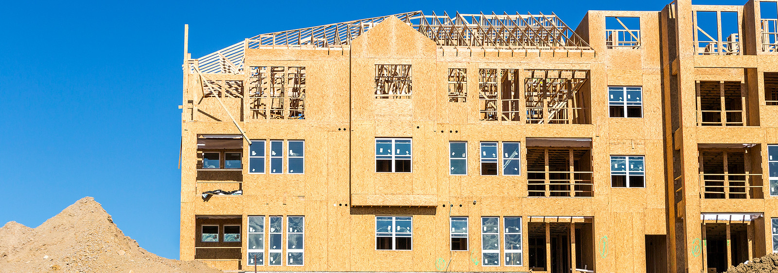 a building under construction with a blue sky in the background