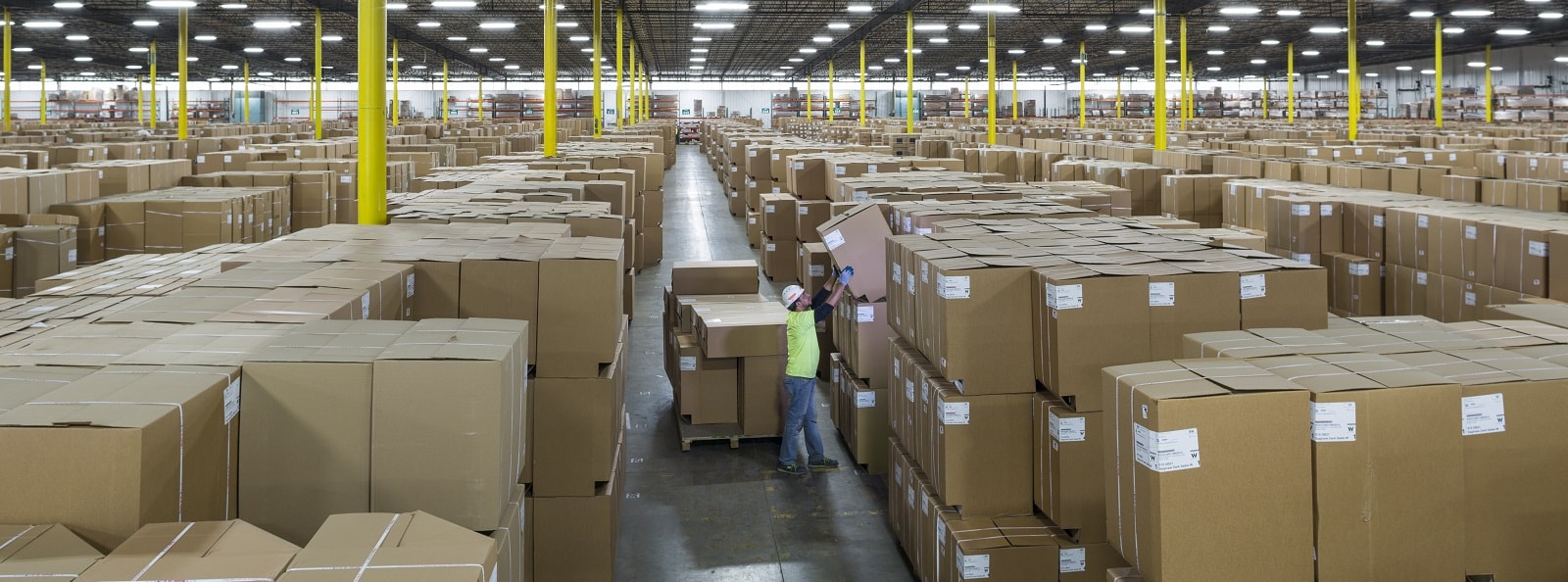 a large warehouse filled with lots of cardboard boxes