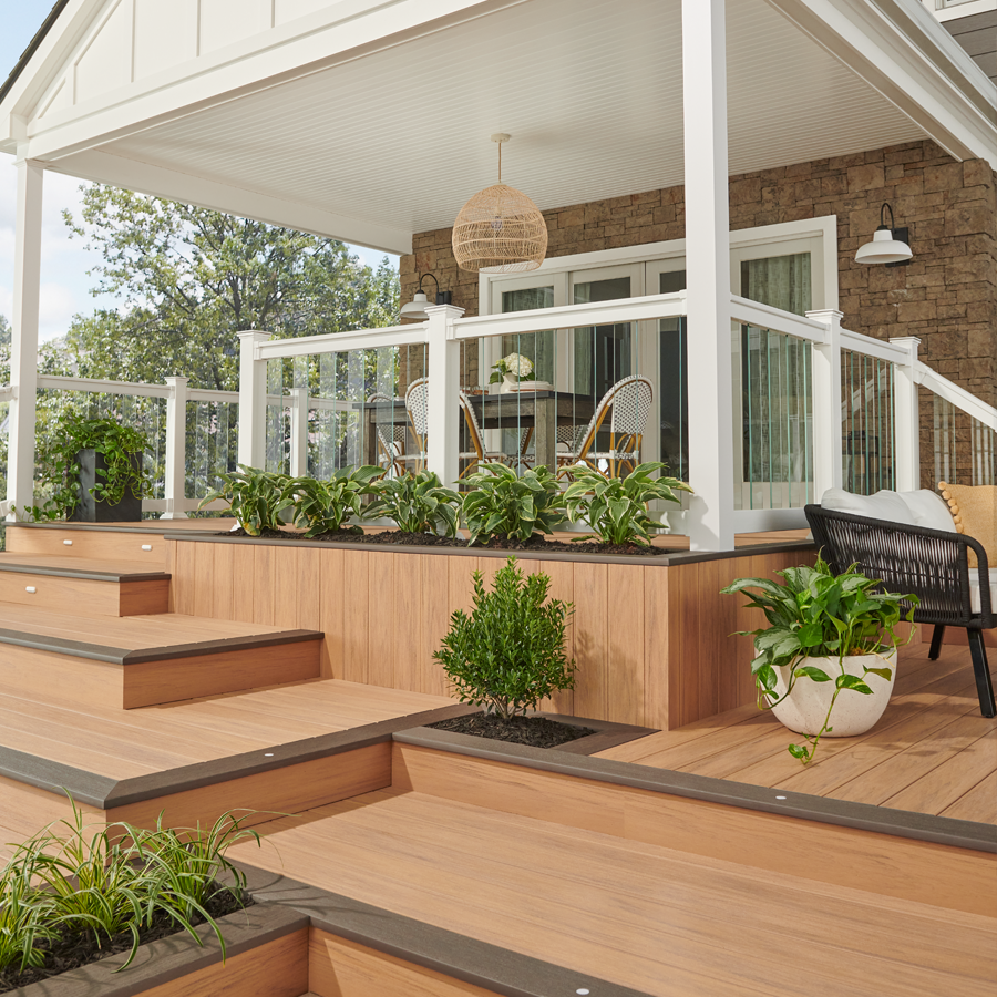 a porch with a table and chairs on it