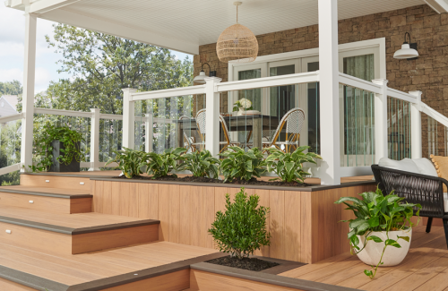 a porch with a table and chairs on it