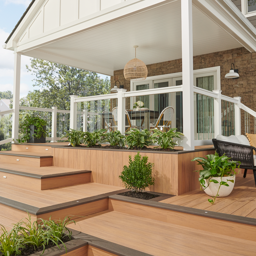 a porch with a table and chairs on it