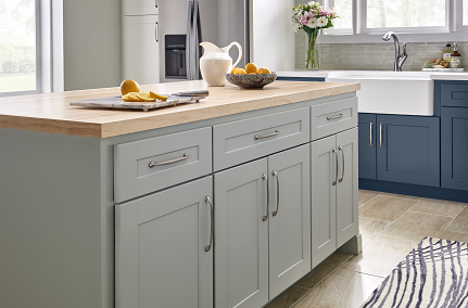 a kitchen with blue cabinets and a white sink