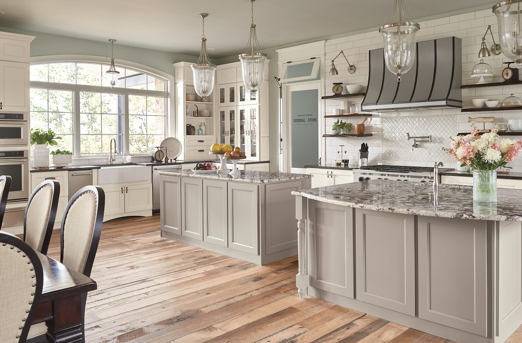 a kitchen with white and grey Wolf cabinets and granite counter tops