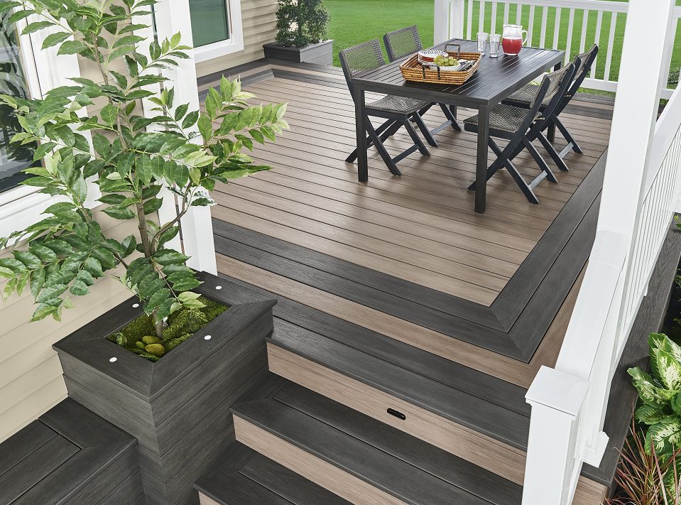 a Wolf wooden deck with a table and chairs on it